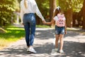 Mother And Daughter Walking Holding Hands In Park, Cropped, Back-View Royalty Free Stock Photo