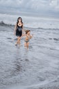 mother and daughter walking by seashore together Royalty Free Stock Photo