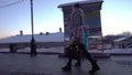 Mother and daughter walking on the street.