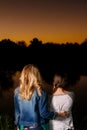 Mother and Daughter Watching the Sunset