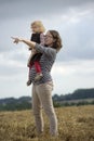 Mother and daughter in a wheat field Royalty Free Stock Photo