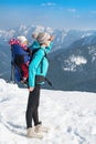 Mother and daughter in winter mountains