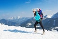 Mother and daughter in winter mountains