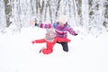 Mother and daughter on winter walk in nature. woman and child girl make snowman Royalty Free Stock Photo