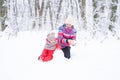 Mother and daughter on winter walk in nature. woman and child girl make snowman Royalty Free Stock Photo