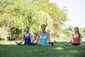 Mother and daughter with yoga exercise outdoors at the park. Health and Fitness concept Royalty Free Stock Photo