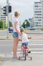 Mother and daughter on zebra crossing. Royalty Free Stock Photo