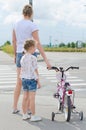 Mother and daughter on zebra crossing. Royalty Free Stock Photo