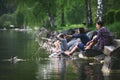 Mother and daughters playing on the bank