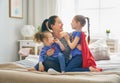 Mother and daughters playing