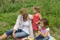 Mother and daughters playing outdoors