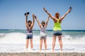 Mother and daughters are standing on the beach on an active family vacation Royalty Free Stock Photo