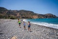 Mother and daughters are walking on the beach on an active family vacation Royalty Free Stock Photo