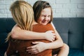 Mother day. Beautiful young woman and her charming little daughter are hugging and smiling. mom gently hugged her daughter, the gi Royalty Free Stock Photo
