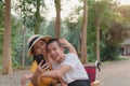 Mother and Disabled child on wheelchair in the city park, They have fun with selfie by smart phone Royalty Free Stock Photo