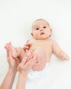 Mother doing gymnastics her baby infant Royalty Free Stock Photo