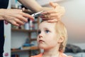 Mother doing haircut for her child at home Royalty Free Stock Photo