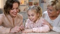 Mother doing manicure for small daughter, pretending to be older, copying mum Royalty Free Stock Photo