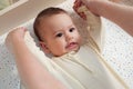 Mother doing massage on her healthy infant baby. Caring Woman Making Gymnastics To little Baby Royalty Free Stock Photo