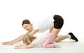 Mother doing sport exercises with daughter