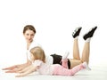 Mother doing sport exercises with her daughter