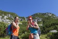 Mother and doughter hikers eating muesli bar Royalty Free Stock Photo