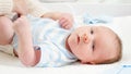 Mother dressing her little baby son lying on changing table at home. Concept of babies and newborn hygiene and Royalty Free Stock Photo