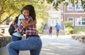 Mother Dropping Off Daughter In Front Of School Gates