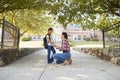 Mother Dropping Off Daughter In Front Of School Gates Royalty Free Stock Photo