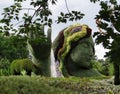 Mother Earth gives life to animals and plants sculpture created with living plants flowers grass