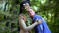 Mother Earth hugging young woman walking in forest, harmony with nature, care Royalty Free Stock Photo