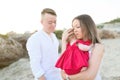 Mother embracing cute baby girl outdoors on the beach Royalty Free Stock Photo