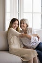 Mother embracing, joking, tickling laughing pre-teen 14s daughter Royalty Free Stock Photo