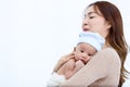 Mother embracing a newborn baby tenderly on the shoulder Royalty Free Stock Photo