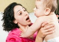 Mother emotion with baby in hands Royalty Free Stock Photo