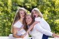 Mother enjoying being outdoors with her daughters on a lovely summer day Royalty Free Stock Photo