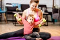 Mother exercising with her baby son at home Royalty Free Stock Photo