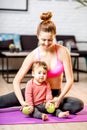 Mother exercising with her baby son at home Royalty Free Stock Photo