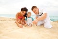 Mother, father and baby on beach Royalty Free Stock Photo