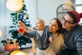 Mother, father and baby holding bauble Royalty Free Stock Photo