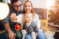 Mother, father and baby holding bauble Royalty Free Stock Photo