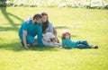 Mother father and child son with pet dog having fun outdoors at summer park. Royalty Free Stock Photo