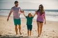 Mother father and child son spending time together. Family summer vacation. Parent dad mom walking with son holds hand Royalty Free Stock Photo