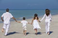 Mother Father and Children Family Running on Beach Royalty Free Stock Photo