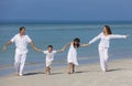 Mother, Father and Children Family Running Having Fun At Beach Royalty Free Stock Photo