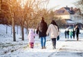 Mother father and daughter walking