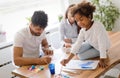 Mother and father drawing together with their child Royalty Free Stock Photo