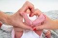Mother father Holding Baby Feet In Heart Shaped Hand in newborn Infant Care Concept Royalty Free Stock Photo