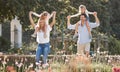 Mother, father and kids in a garden as a happy family outdoors in summer to relax, bond and have fun together. Flowers Royalty Free Stock Photo