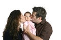 Mother and father kissing cute baby Royalty Free Stock Photo